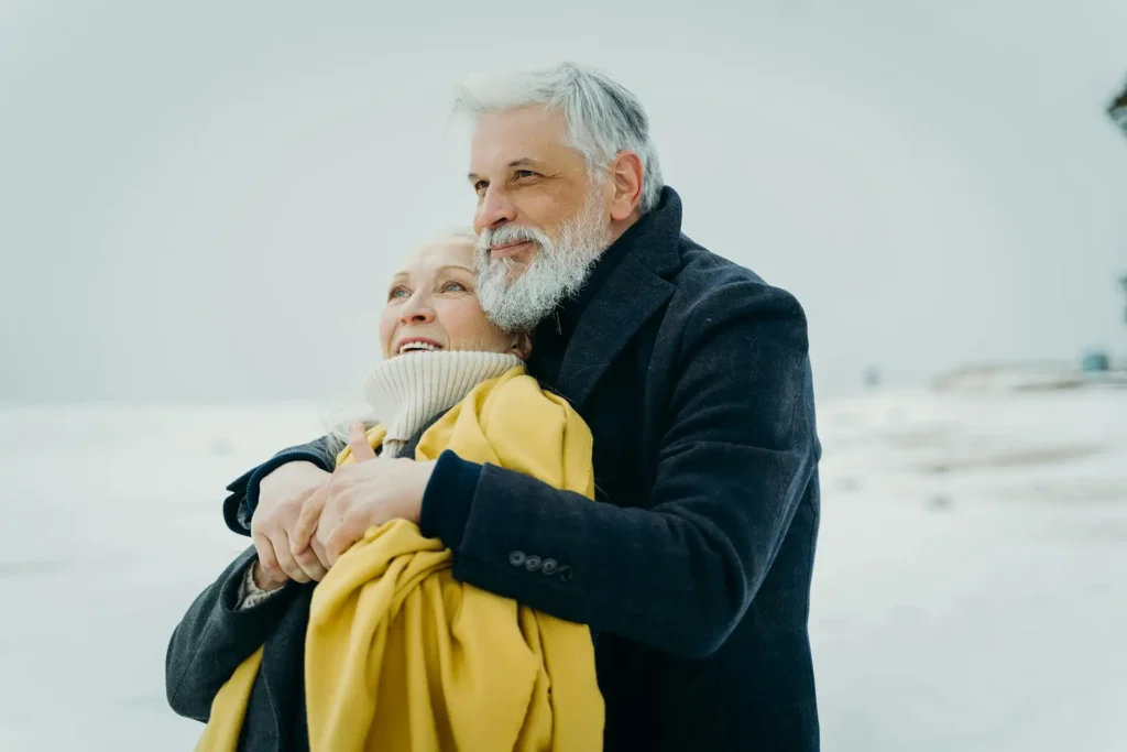 Men's health - happy man and woman couple enjoying time by seaside.